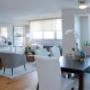 Living and dining room with custom roll-up blinds. Living and dining room with custom roll-up blinds.