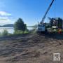 Heavy equipment and crane operations at active construction site. Heavy equipment and crane operations at active construction site.