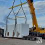 Crane lifting prefabricated modular unit for facility integration. Crane lifting prefabricated modular unit for facility integration.
