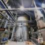 Wide view of facility interior with complex mechanical systems. Wide view of facility interior with complex mechanical systems.
