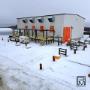 Snow-covered modular office showing winter site readiness. Snow-covered modular office showing winter site readiness.