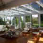 This sunroom opens up the whole back of the house. With the wall removed the kitchen is part of a great room that includes the dining and living room area and easy access to the backyard. This sunroom opens up the whole back of the house. With the wall removed the kitchen is part of a great room that includes the dining and living room area and easy access to the backyard.