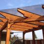 This pergola with a angle built in to it covers a BBQ area This pergola with a angle built in to it covers a BBQ area