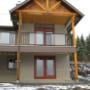 timber frame house with glass and iron railings timber frame house with glass and iron railings