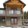 timber frame house with glass and iron railings timber frame house with glass and iron railings