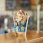 Hot fudge sundae in a cup in a Ben & Jerry's ice cream shop. Hot fudge sundae in a cup in a Ben & Jerry's ice cream shop.