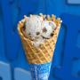 A freshly baked waffle cone in a Ben & Jerry's ice cream shop. A freshly baked waffle cone in a Ben & Jerry's ice cream shop.