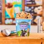 Fresh packed pint in front of Ben & Jerry's ice cream shop menu board. Fresh packed pint in front of Ben & Jerry's ice cream shop menu board.