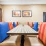 Enjoy breakfast in this seating area Enjoy breakfast in this seating area