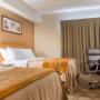 Guest room with double beds Guest room with double beds