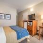 Guest room with flat-screen television Guest room with flat-screen television