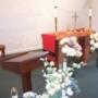 The chapel is decorated with silk flowers and candles. The chapel is decorated with silk flowers and candles.