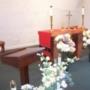 The chapel is decorated with silk flowers and candles. The chapel is decorated with silk flowers and candles.