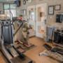 Fitness center with cardio equipment and weights Fitness center with cardio equipment and weights