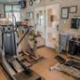 Fitness center with cardio equipment and weights Fitness center with cardio equipment and weights