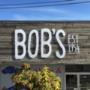 Bob’s – Williams lake , custom laser cut acrylic letters mounted with standoffs on old barn board wall surface Bob’s – Williams lake , custom laser cut acrylic letters mounted with standoffs on old barn board wall surface