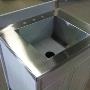 Stainless steel laundry counter with an integral sink and back splash. Stainless steel laundry counter with an integral sink and back splash.