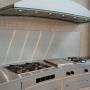 Custom curved stainless steel drawers, counter top and wall panel. Custom curved stainless steel drawers, counter top and wall panel.