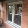 New Northstar Vinyl Single Hung Windows with SDL vertical grills - Hickory Colour New Northstar Vinyl Single Hung Windows with SDL vertical grills - Hickory Colour