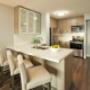 Modern kitchen with stainless steel appliances and breakfast bar at Main Square in Toronto, ON Modern kitchen with stainless steel appliances and breakfast bar at Main Square in Toronto, ON