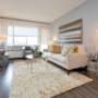 Spacious living room with large windows at Main Square in Toronto, ON Spacious living room with large windows at Main Square in Toronto, ON
