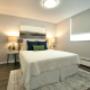 Large bedroom with mirrored closet at Main Square in Toronto, ON Large bedroom with mirrored closet at Main Square in Toronto, ON
