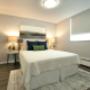 Large bedroom with mirrored closet at Main Square in Toronto, ON Large bedroom with mirrored closet at Main Square in Toronto, ON