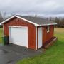 Garage retrofit: New garage door, exterior steel door, shingles, retaining wall and stones around 3 sides and a short french drain. Garage retrofit: New garage door, exterior steel door, shingles, retaining wall and stones around 3 sides and a short french drain.