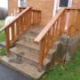 Wooden railings anchored into an old concrete step. Wooden railings anchored into an old concrete step.