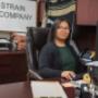 Sara Strain, Receptionist/Assistant, at the front desk of Strain and Company Sara Strain, Receptionist/Assistant, at the front desk of Strain and Company