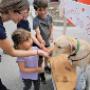 Children play with a yellow labrador at Sage Creek Animal Hospital. Children play with a yellow labrador at Sage Creek Animal Hospital.