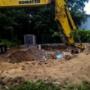 Before: Job site filling in a pool. Komatsu digging out debris to be loaded into the truck. Before: Job site filling in a pool. Komatsu digging out debris to be loaded into the truck.