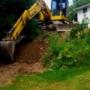 Equipment Operator Justin in the Komatsu waiting to load the truck with debris from a job in Fredericton filling in a pool. Equipment Operator Justin in the Komatsu waiting to load the truck with debris from a job in Fredericton filling in a pool.
