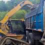 One of our tracked Skid Steers loading the truck. One of our tracked Skid Steers loading the truck.