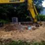 Before: Job site filling in a pool. Komatsu digging out debris to be loaded into the truck. Before: Job site filling in a pool. Komatsu digging out debris to be loaded into the truck.
