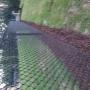 Black chainlink with mulch Black chainlink with mulch
