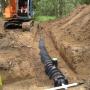 Picture of new field with black infiltrators and pressure distribution of the effluent. Picture of new field with black infiltrators and pressure distribution of the effluent.