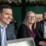 Three Virtus Group employees smiling and laughing at a work event. Three Virtus Group employees smiling and laughing at a work event.