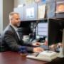 Virtus Group manager working at desk Virtus Group manager working at desk