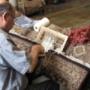 A client’s rug has been laid out on the “operating table” in order to re-weave a section that has been damaged through the passage of time under heavy furniture. Knot by knot, our repairman works diligently with the precision of a surgeon. A client’s rug has been laid out on the “operating table” in order to re-weave a section that has been damaged through the passage of time under heavy furniture. Knot by knot, our repairman works diligently with the precision of a surgeon.