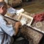 A client’s rug has been laid out on the “operating table” in order to re-weave a section that has been damaged through the passage of time under heavy furniture. Knot by knot, our repairman works diligently with the precision of a surgeon. A client’s rug has been laid out on the “operating table” in order to re-weave a section that has been damaged through the passage of time under heavy furniture. Knot by knot, our repairman works diligently with the precision of a surgeon.