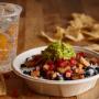 A burrito bowl topped with freshly grilled adobo chicken brings the flavor! A burrito bowl topped with freshly grilled adobo chicken brings the flavor!