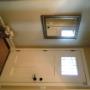 Front door and foyer in beige with white door Front door and foyer in beige with white door