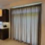 Custom drapery in style on a patio door Custom drapery in style on a patio door