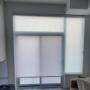 Window shade - Roller shade -light filtering fabric on a patio door Window shade - Roller shade -light filtering fabric on a patio door