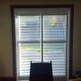 Framed Vinyl Shutters with By-Pass Track System on a Patio Door in a Richmond Hill Home Framed Vinyl Shutters with By-Pass Track System on a Patio Door in a Richmond Hill Home