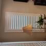 Maxxmar Framed Vinyl Shutters with 3 1/2 Inch Louvers on the Left Side of a Living Room Window in a Thornhill Home Maxxmar Framed Vinyl Shutters with 3 1/2 Inch Louvers on the Left Side of a Living Room Window in a Thornhill Home