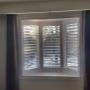 Framed Vinyl Shutters on a Primary Bedroom Bay Window in a Richmond Hill Home Framed Vinyl Shutters on a Primary Bedroom Bay Window in a Richmond Hill Home