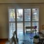 Framed Bi-Fold Vinyl Shutters on a Patio Door with All Panels in the Closed Position in a Richmond Hill Home Framed Bi-Fold Vinyl Shutters on a Patio Door with All Panels in the Closed Position in a Richmond Hill Home