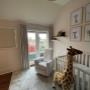 Baby room with stuffed giraffe and custom fabric drapes Baby room with stuffed giraffe and custom fabric drapes